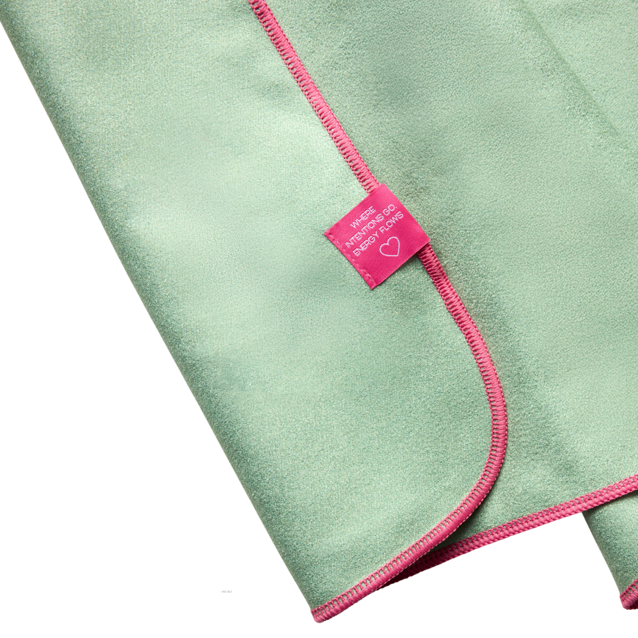 green hand towel with pink border showing back of logo tag