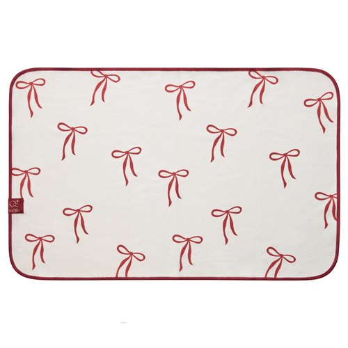 White hand towel with red bow pattern on a white background