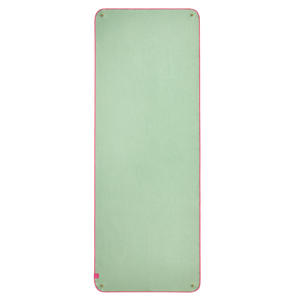 Green yoga mat towel with pink border on a white background