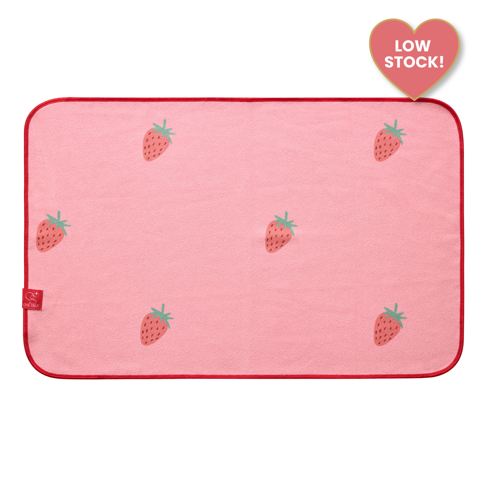 pink yoga hand towel with strawberries and label that says "low stock"