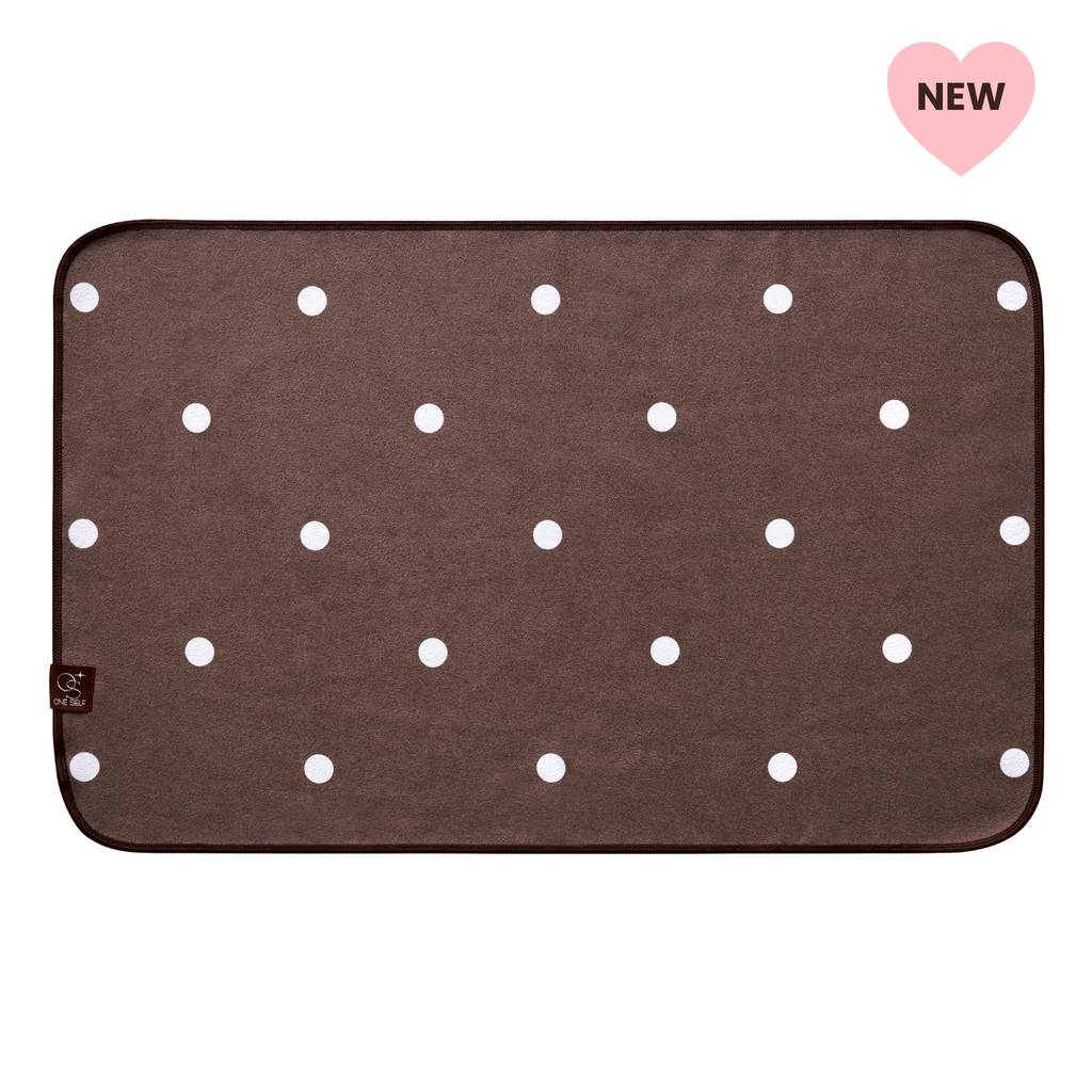 dark brown and white polka dot hand towel with one self logo and "new" label